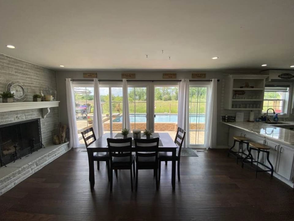 Dining area with fabulous views looking out over the Pool and Patio Space.  