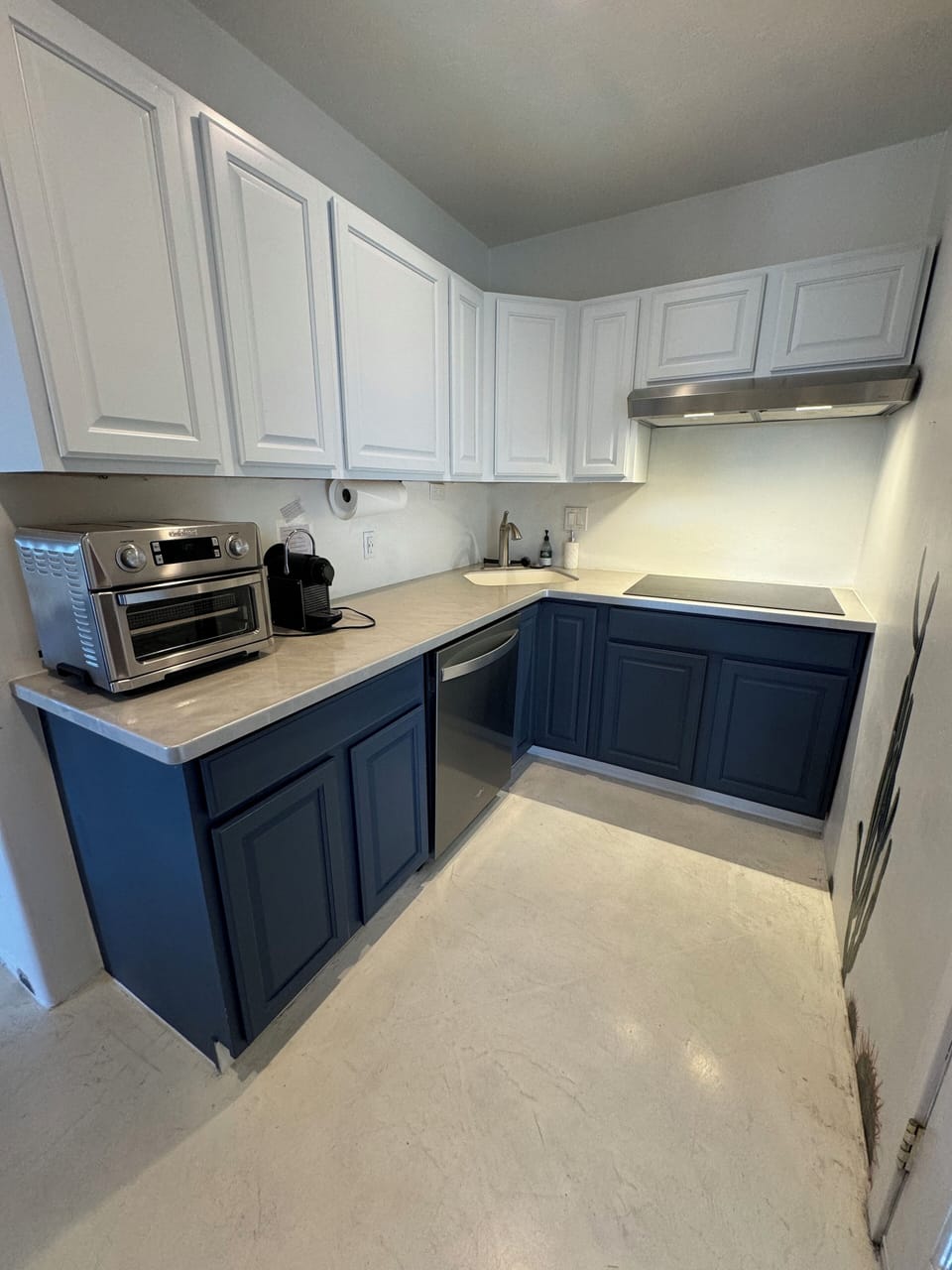 Kitchen with cooktop, microwave, air fryer + Nespresso coffee machine