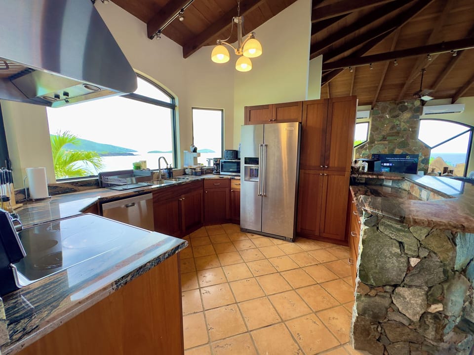 Open concept Kitchen with magens bay & sunset views