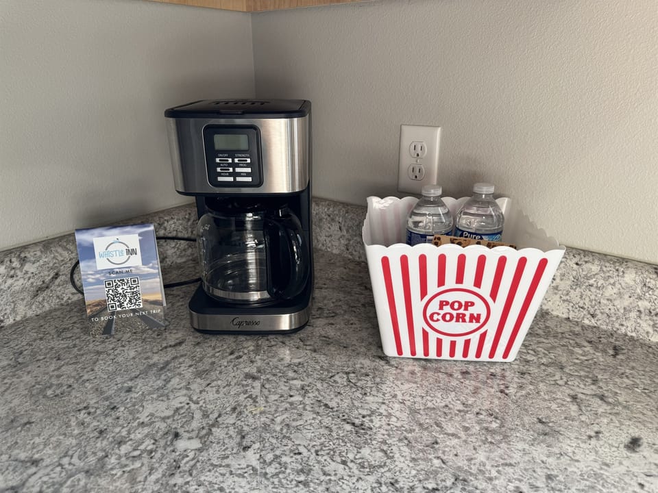 Both K-cup and standard coffee maker on counter for ease of use