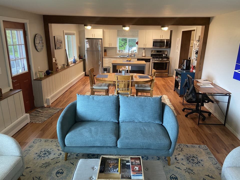 Full view of Living room, dining table and kitchen. 