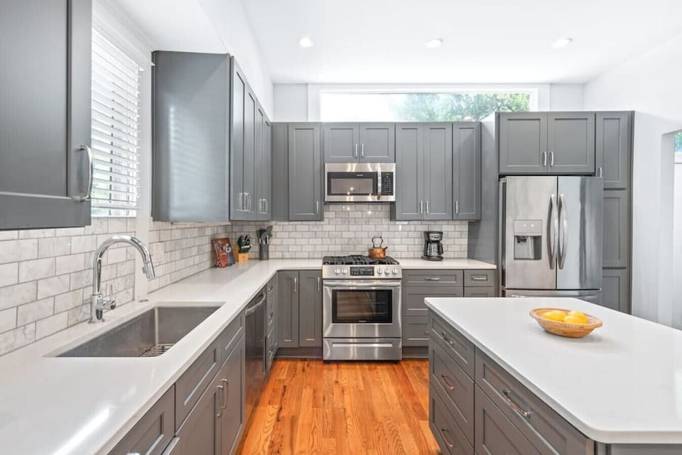Whip up your favorite dishes in our sleek kitchen, equipped with top-of-the-line appliances and a generous center island.