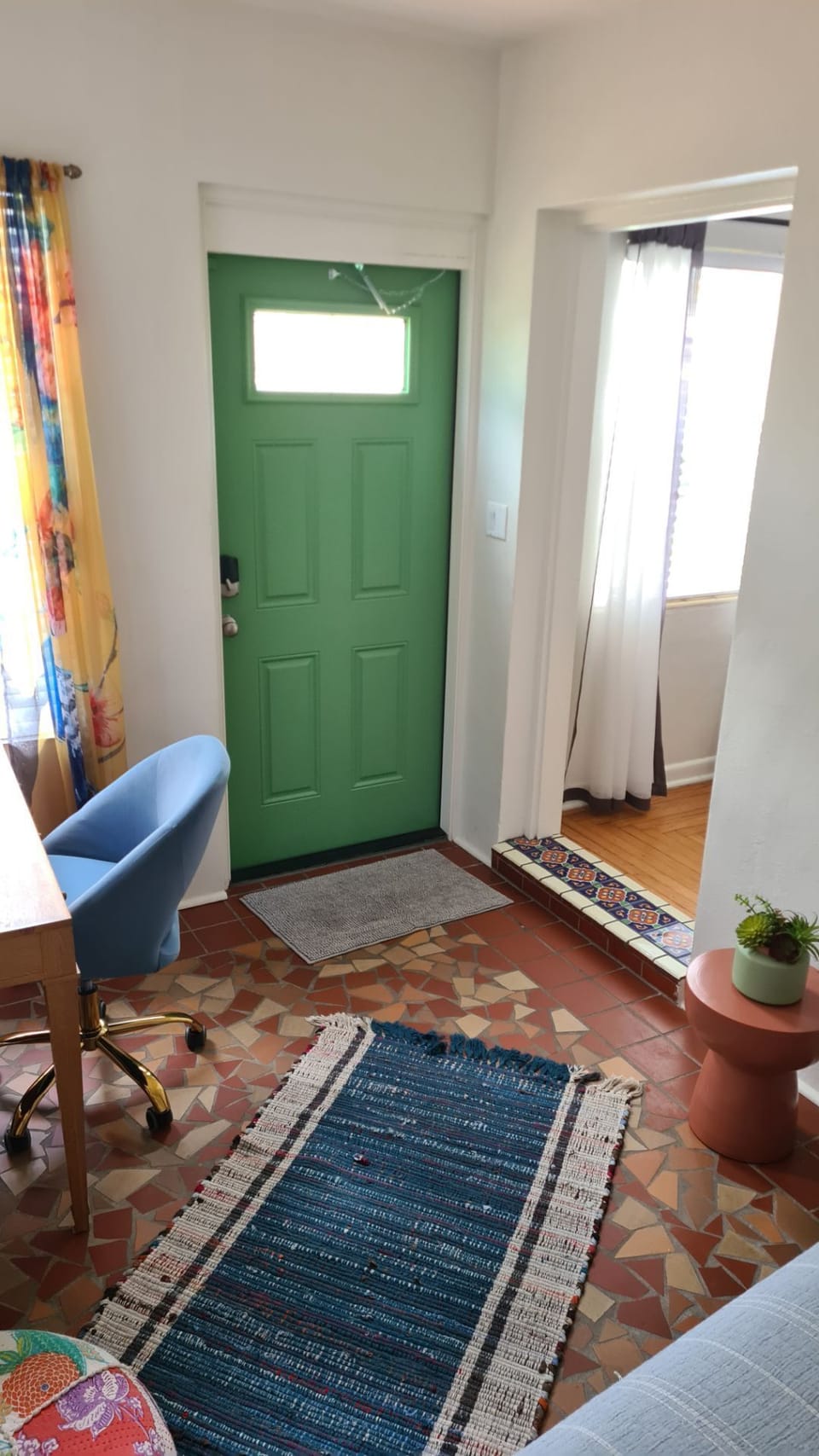 Room shares front door and living room entryways.