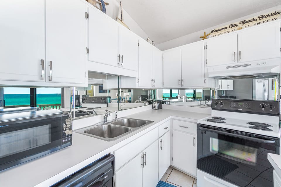 Upper fully stocked kitchen.