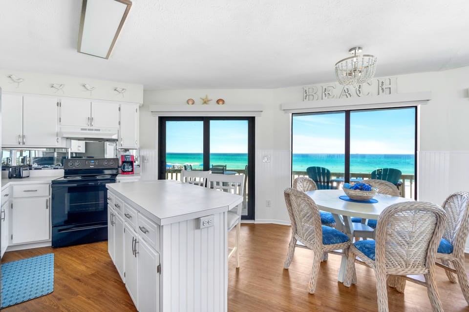 Lower level large kitchen, dinning and living area with views from every stance.
