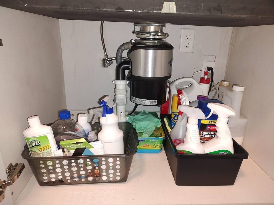 Cleaning supplies are also available in the sink cabinet.