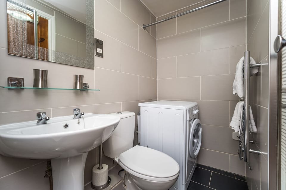 There is a small utility area at the far end of the shower room