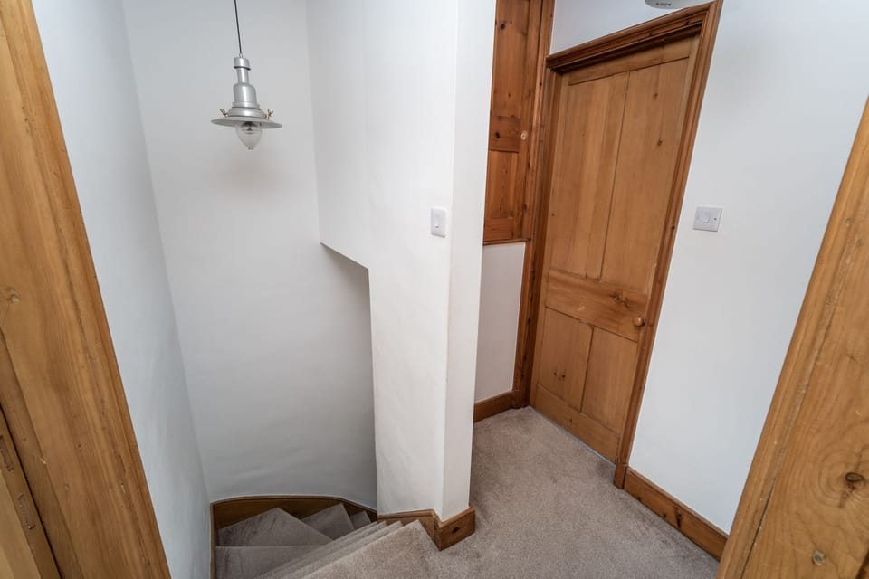 You can find the bedrooms and bathroom on the first floor of the cottage