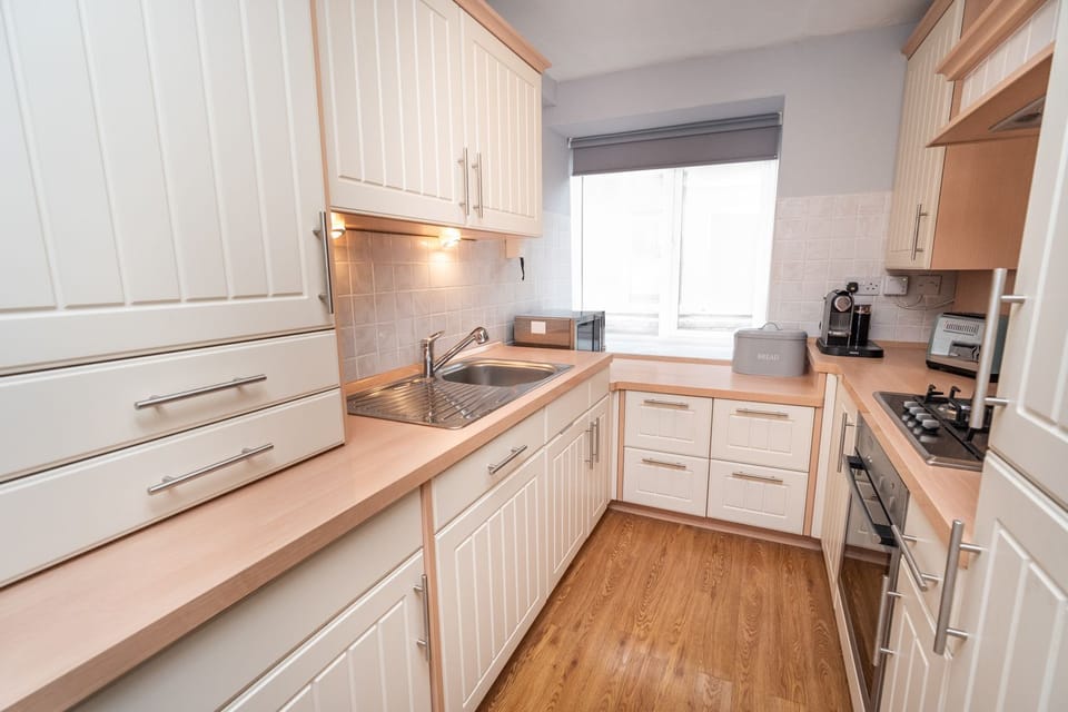 An elegant and modern kitchen has everything that you need to cook dinner during your self catering holiday in Keswick