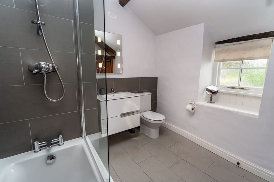 The well lit bathroom is the perfect space to get ready for dinner at a nearby restaurant