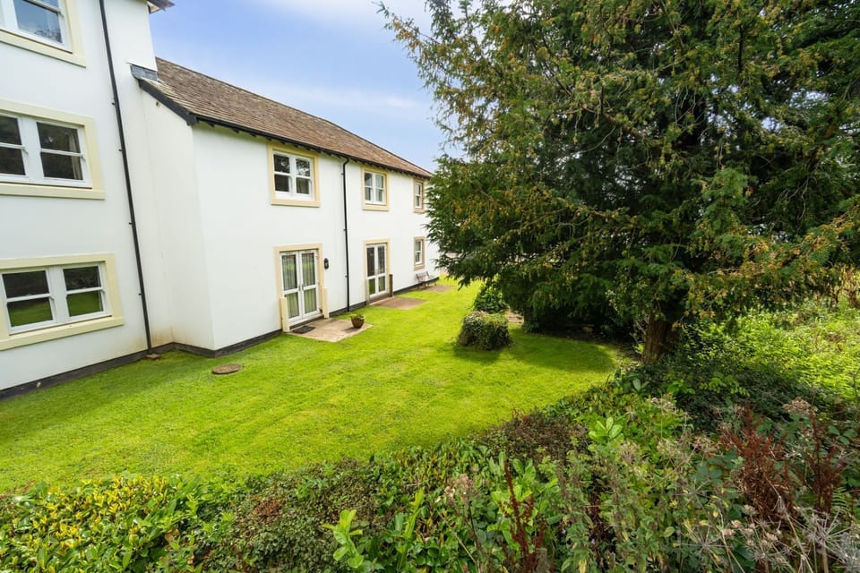 The property is set out over 2 floors and has double doors from the living area to the shared garden