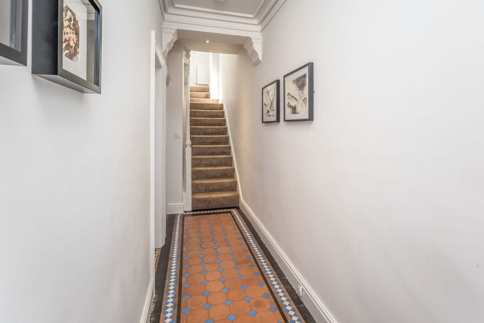 The master bedroom on the 1st floor has an ensuite shower room