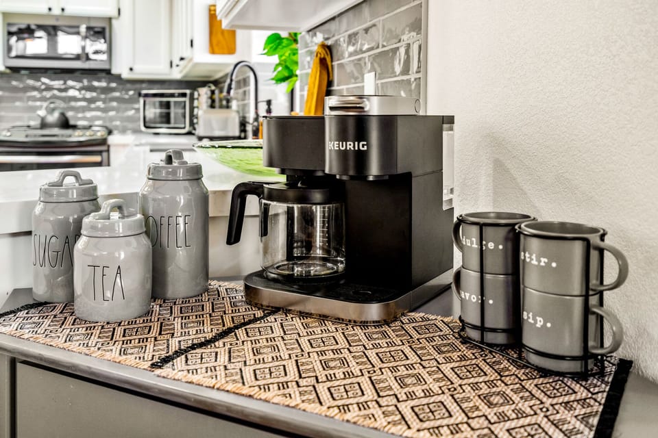 Coffee Bar. Keurig pods with Drip Coffee Maker with Tea and Condiments. 