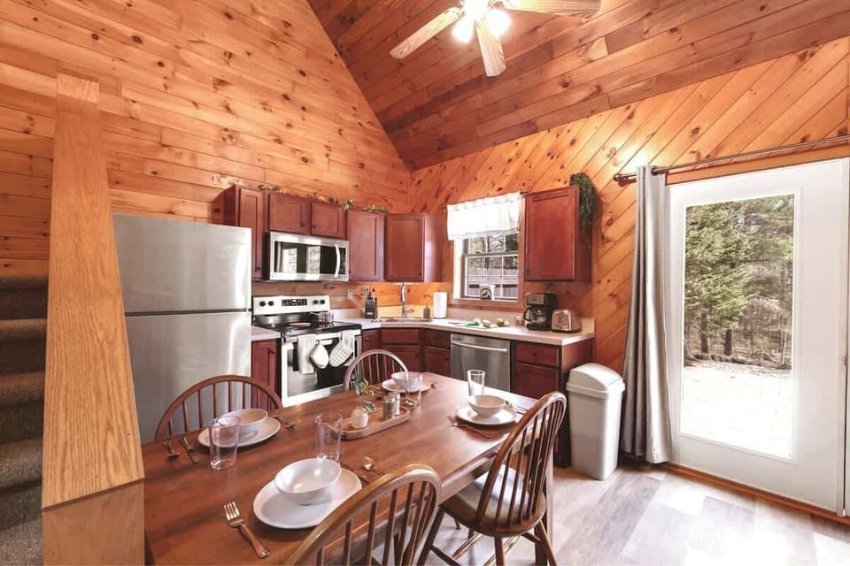 A full size oven, refrigerator, dishwasher, microwave, toaster, and coffee pot are only some of the amenities included in this fully-stocked kitchen.