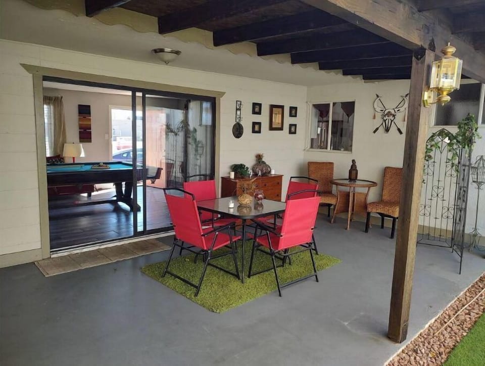 The shaded patio area is the ideal spot to unwind and enjoy the evening breeze.