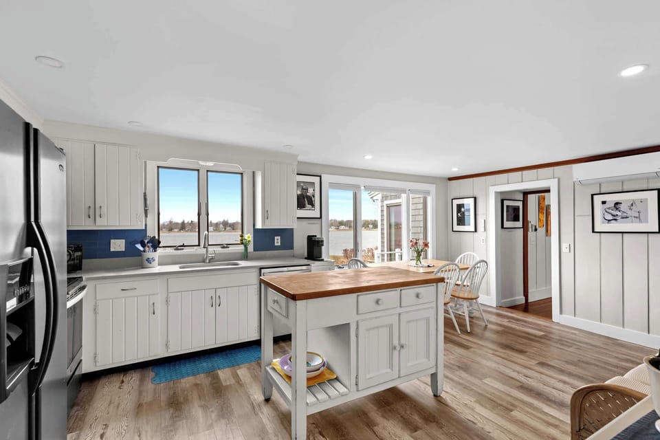 Bright waterfront kitchen with island and easy open layout