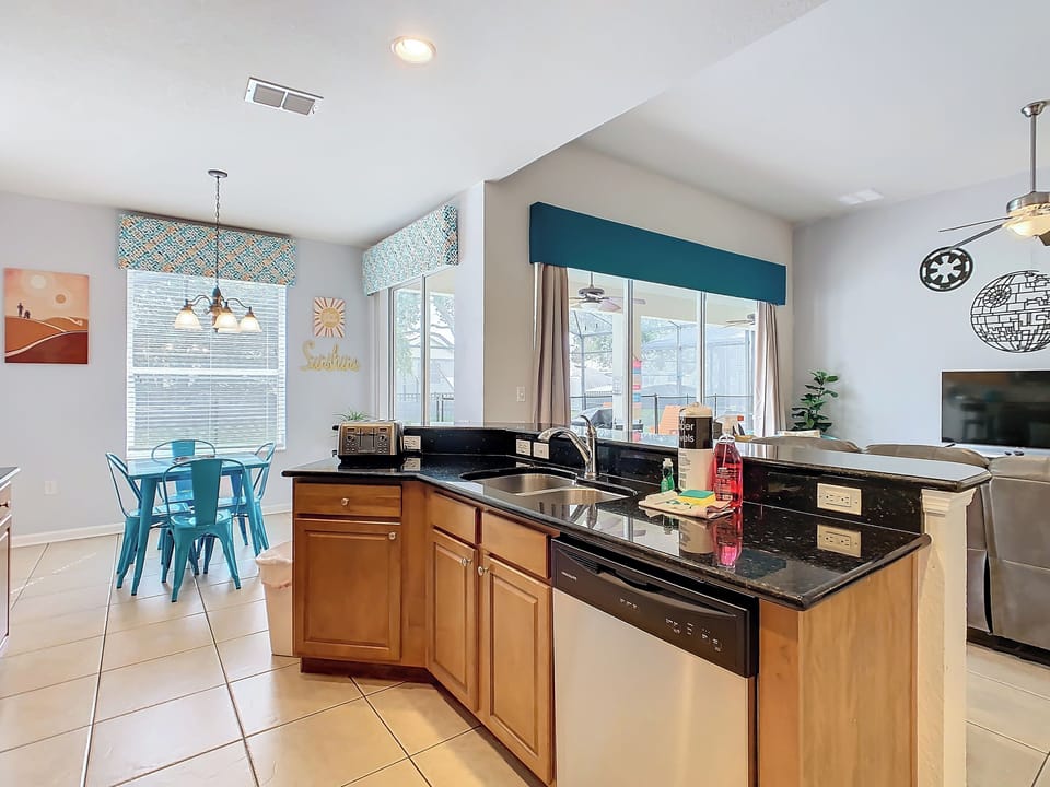 The modern kitchen is fully-equipped for preparing meals or snacks