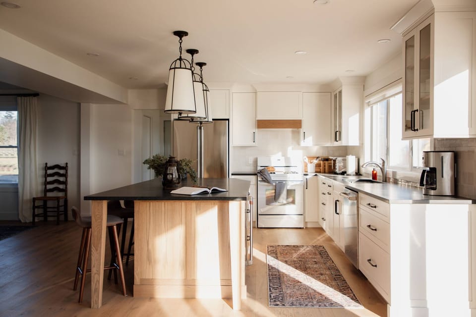 Sunlight floods the kitchen. You'll notice we are still waiting on our matching stove and range but the placeholder is quite lovely in the meantime.