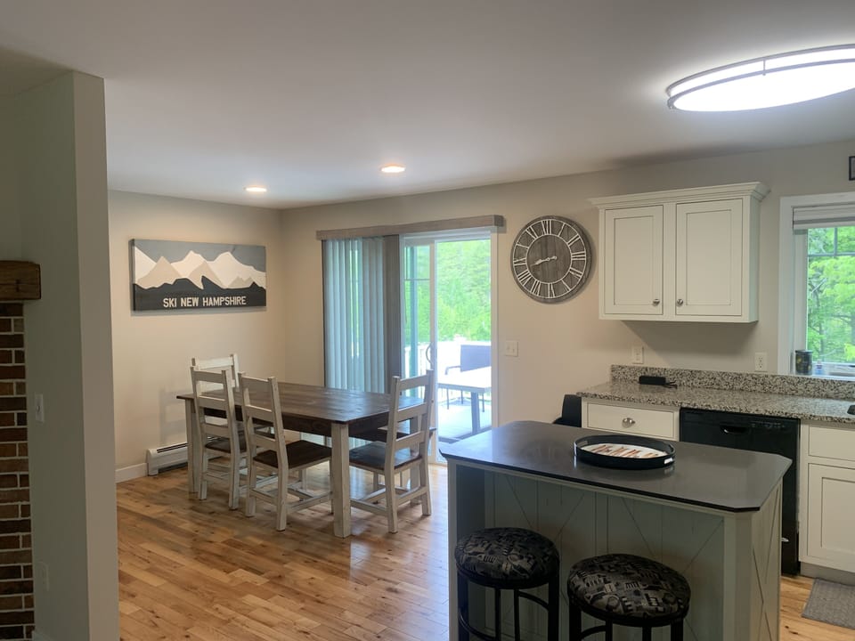 View from living room into kitchen and dining room