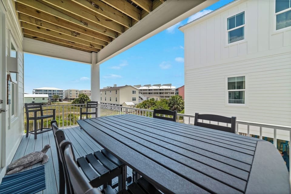 Large dining table right outside the inside dining area.