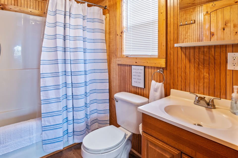 The bunkhouse bathroom has a tub/shower combo.