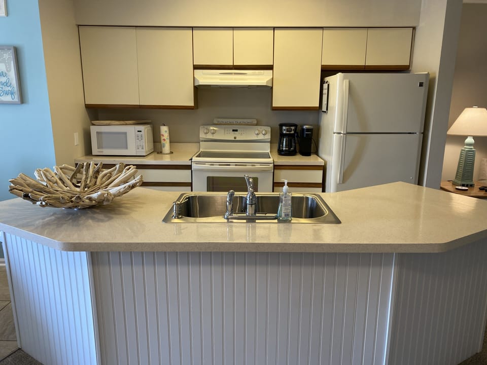 Fully stocked kitchen with Keurig and coffee pot