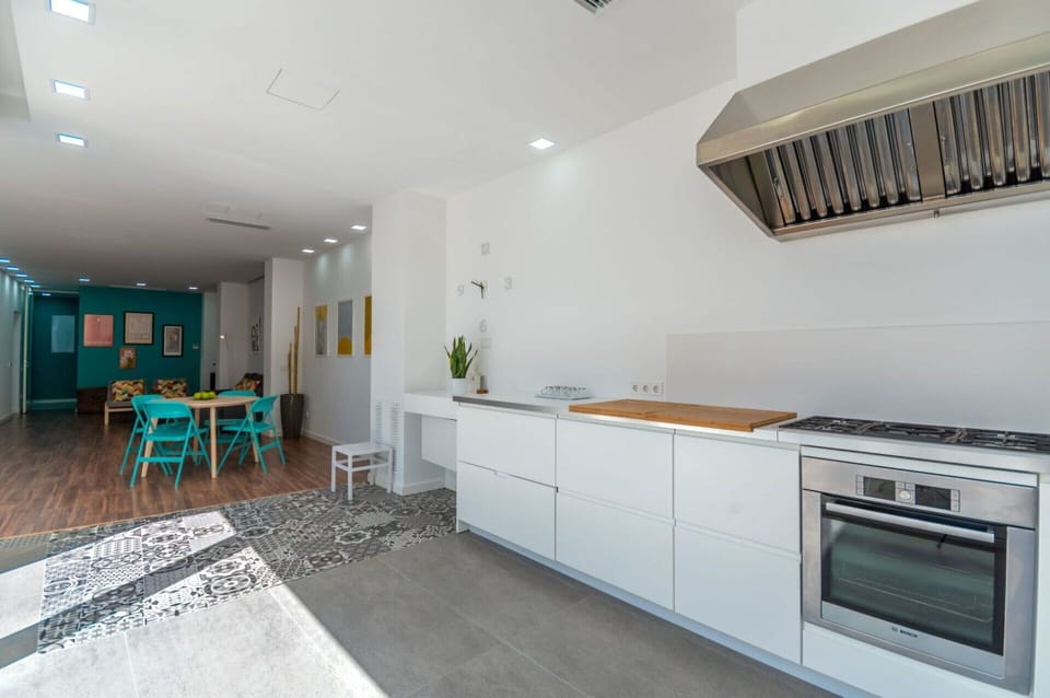 Cabinetry, Building, Furniture, Countertop, Kitchen Stove, Chair, Kitchen Appliance, Houseplant, Interior Design, Lighting