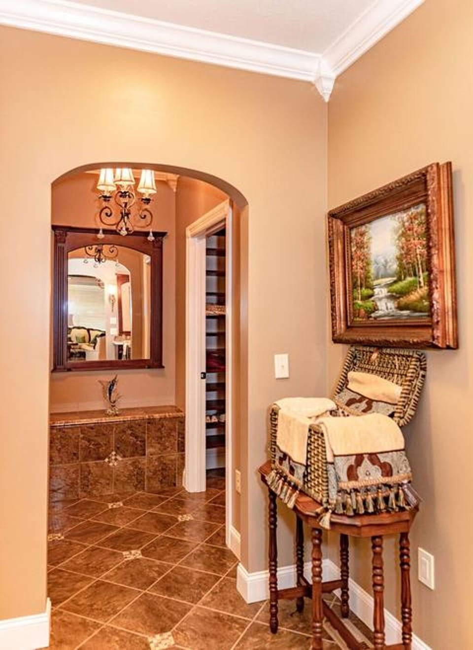 Inside the large master suite bathroom looking towards the walk-in closet
