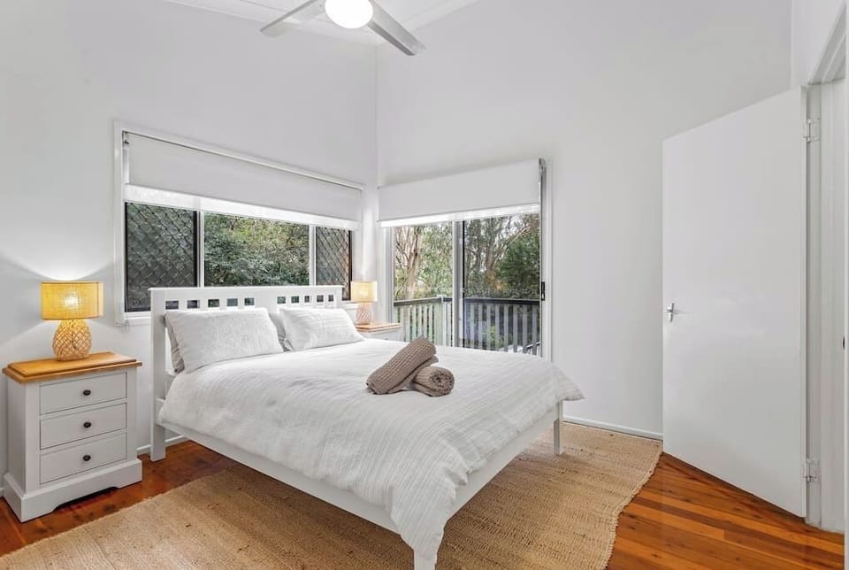 Main Queen bedroom with private balcony. Built in wardrobe, ceiling fan.