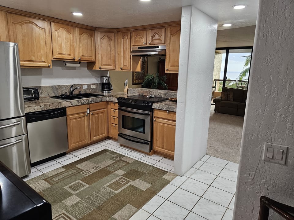 Full Kitchen, plates, bowls, cups, saucers, utensils, pots and pans.