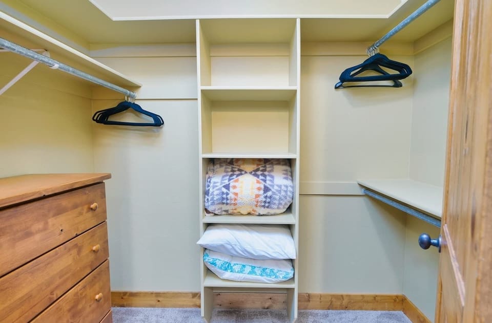 The en suite bath comes with a double vanity, large tub/shower combo, and a spacious closet.