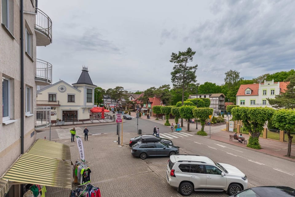 Street view with parked cars and well-maintained surroundings.
