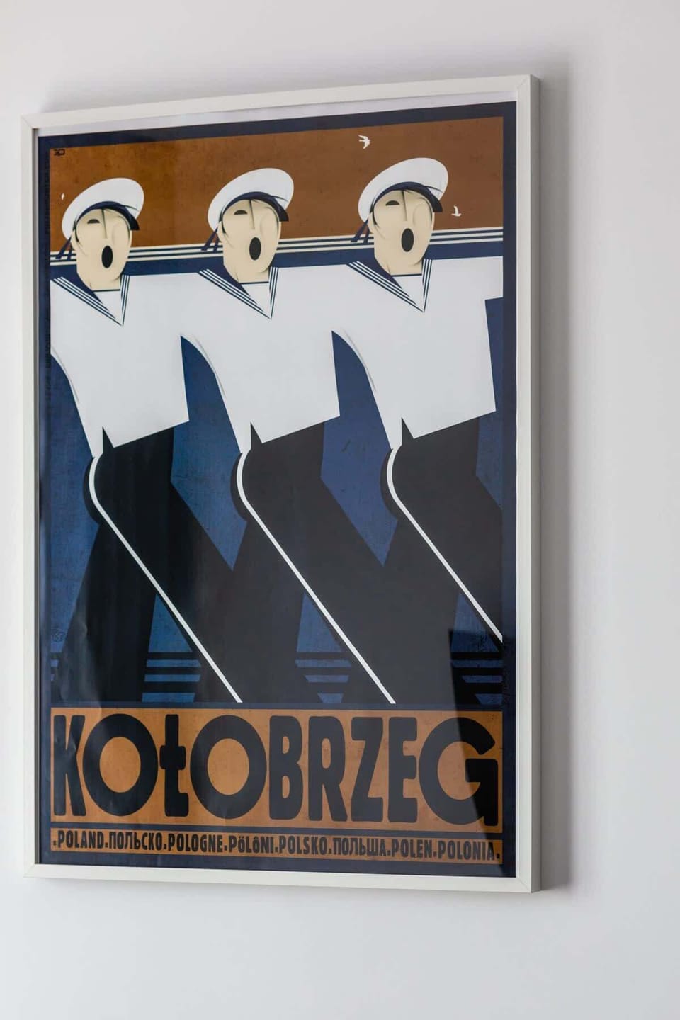 Close-up of a decorative wall poster adding a modern touch to the room.
