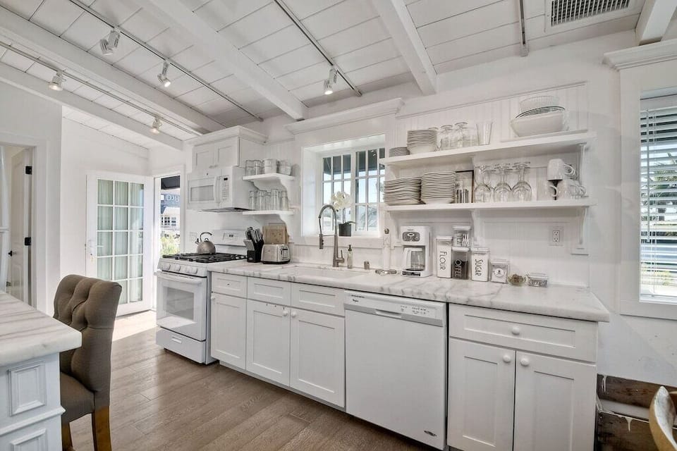 Kitchen with lots of dishes to use.