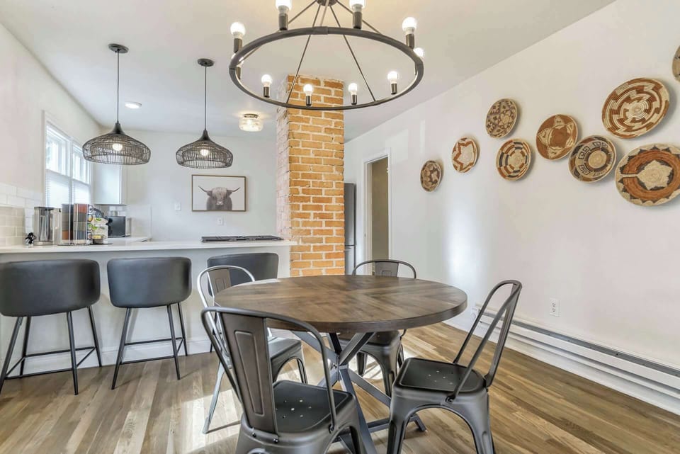 Gather around the dining table for meals and conversation in a cozy setting.