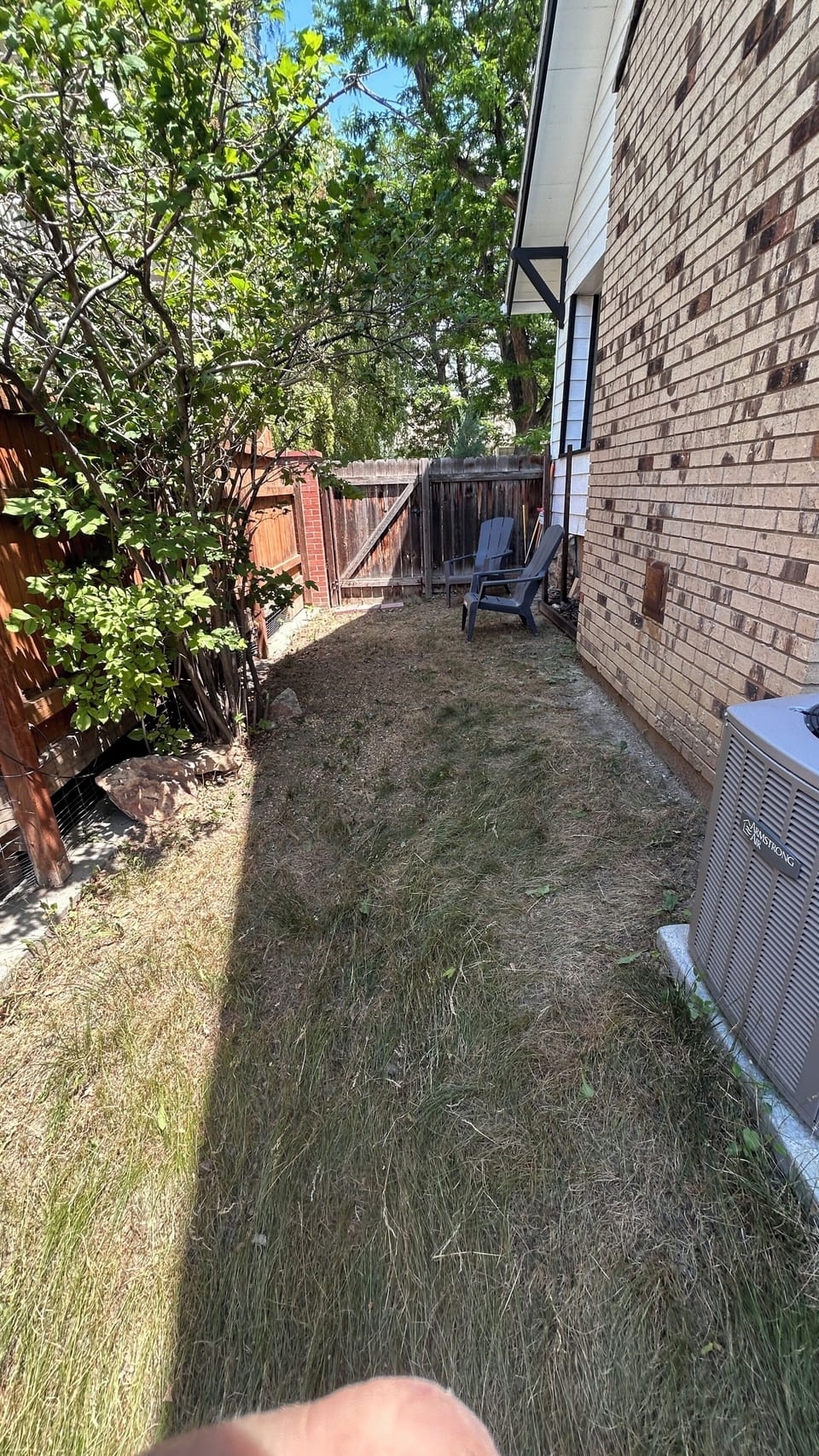 Private Side yard (enclosed on 3 sides). Charcoal BBQ and Outdoor seats provided