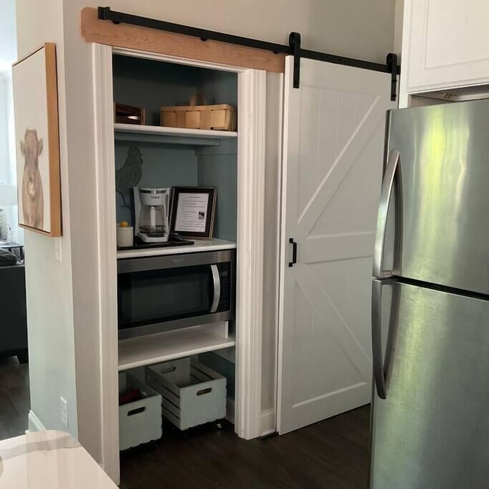 Coffee Nook, next to full walk-in pantry. The barn door slides to access both sides.