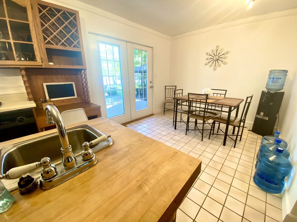 Kitchen seating and small desk area. Patio doors to deck