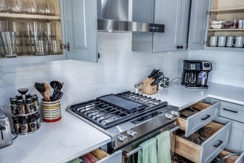 Fully stocked Stainless steel kitchen. This is a total remodeled Kitchen and includes everything for your cooking needs.  Drip coffee maker, spice rack, toaster, knife set.  Tons of baking ware, pots & pans, mugs for your coffee, dinner set for 16!