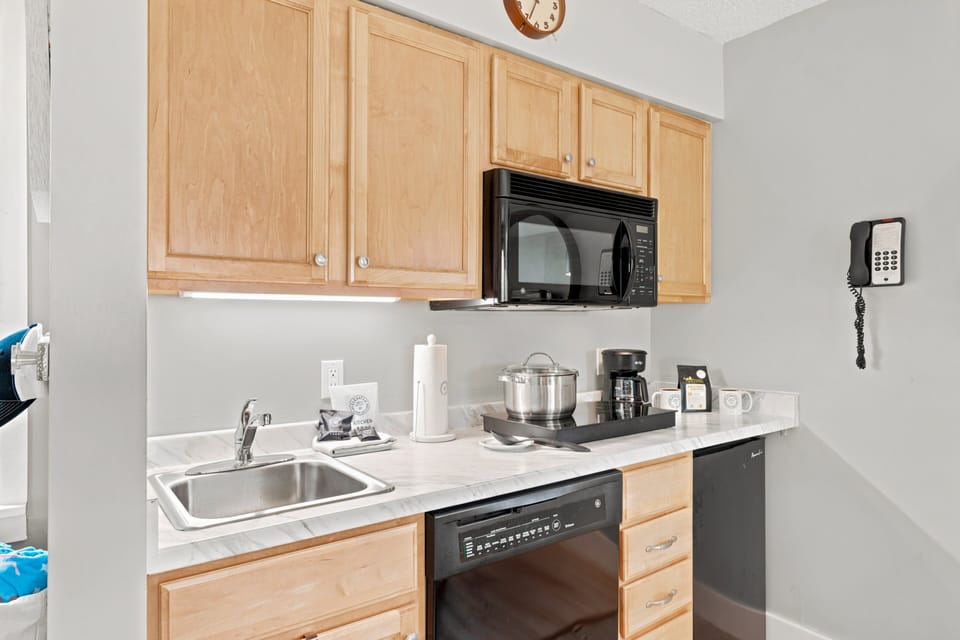 Fully equipped with everything you need to cook a  meal — cookware, coffee, appliances, already stocked.