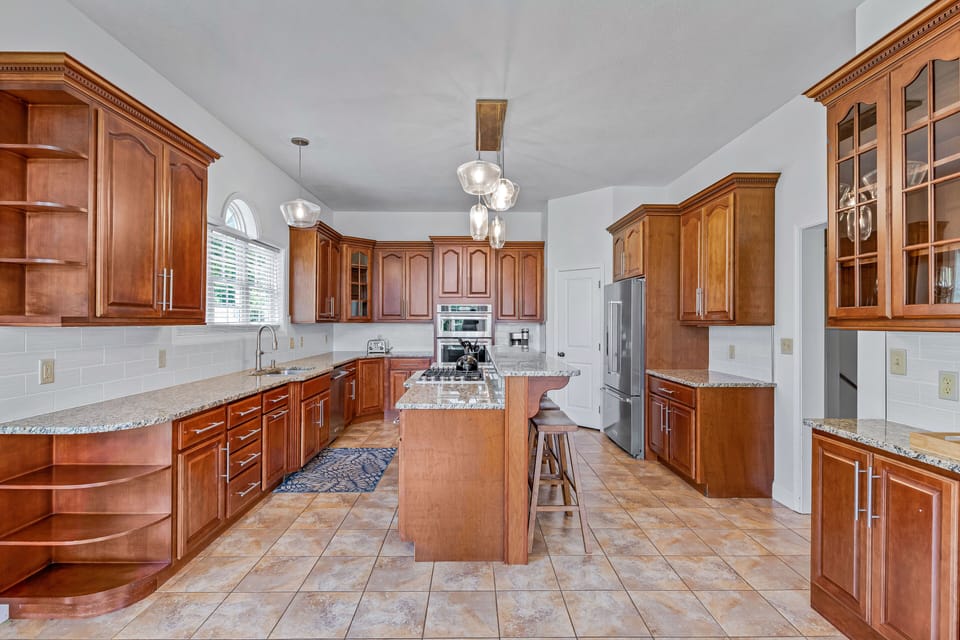 Play Chef Within The Home's Spacious Gourmet Kitchen Featuring Massive Granite Countertops.