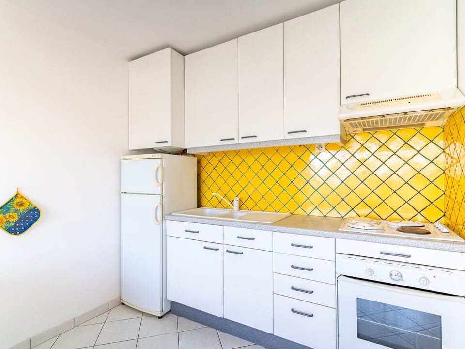 Cabinetry, Furniture, Countertop, Building, Drawer, Kitchen, Interior Design, Flooring, Floor, Tap