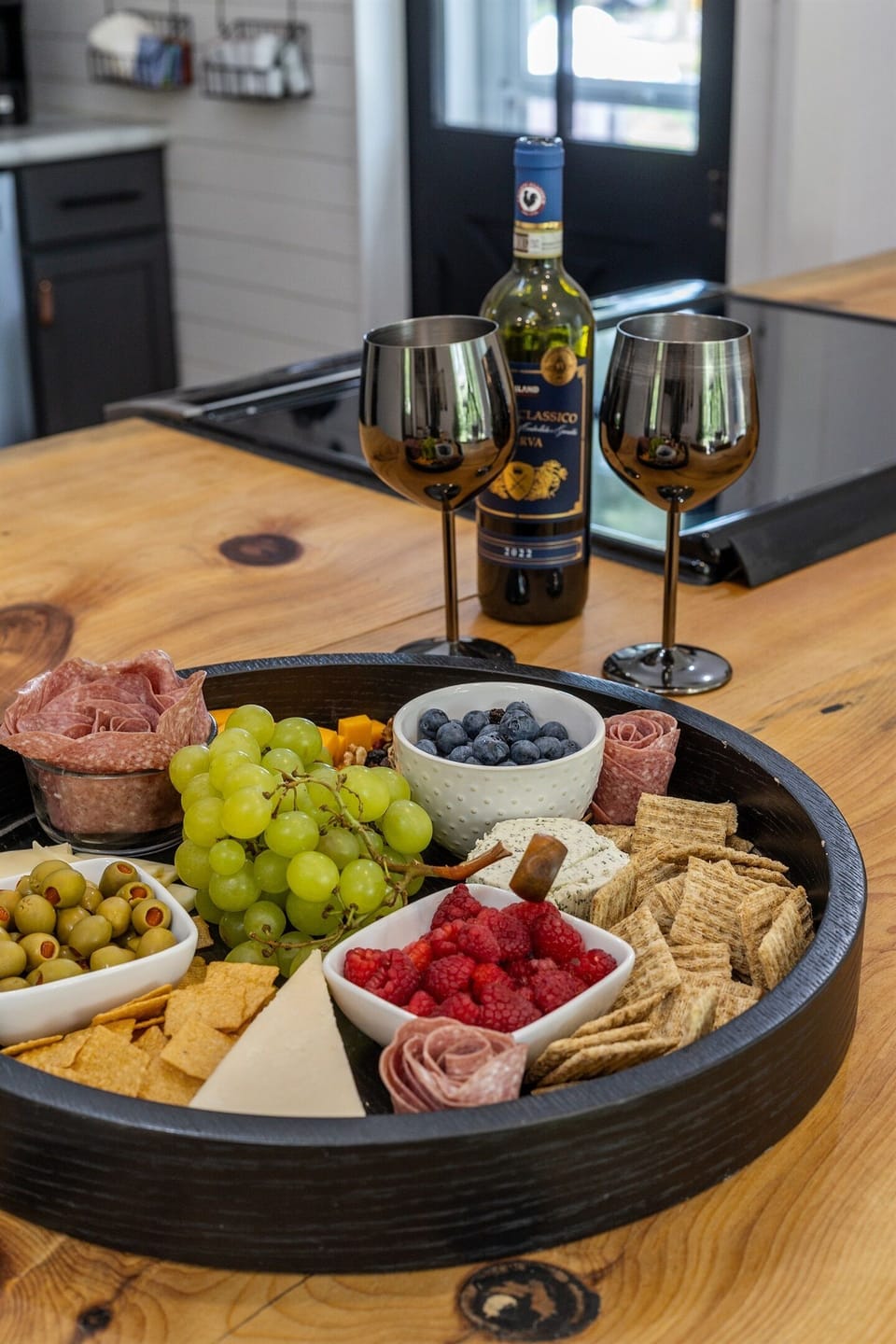 Whether it's a charcuterie spread, takeout, or a home-cooked feast, this is the perfect place to gather.