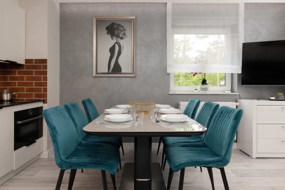Large table with chairs for eating communal meals. 
