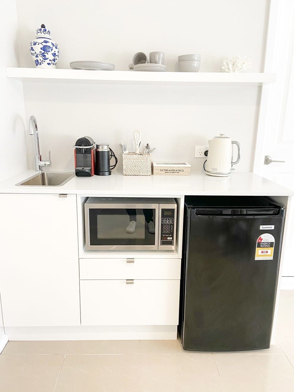 Downstairs kitchenette. Sink, microwave and bar fridge 
