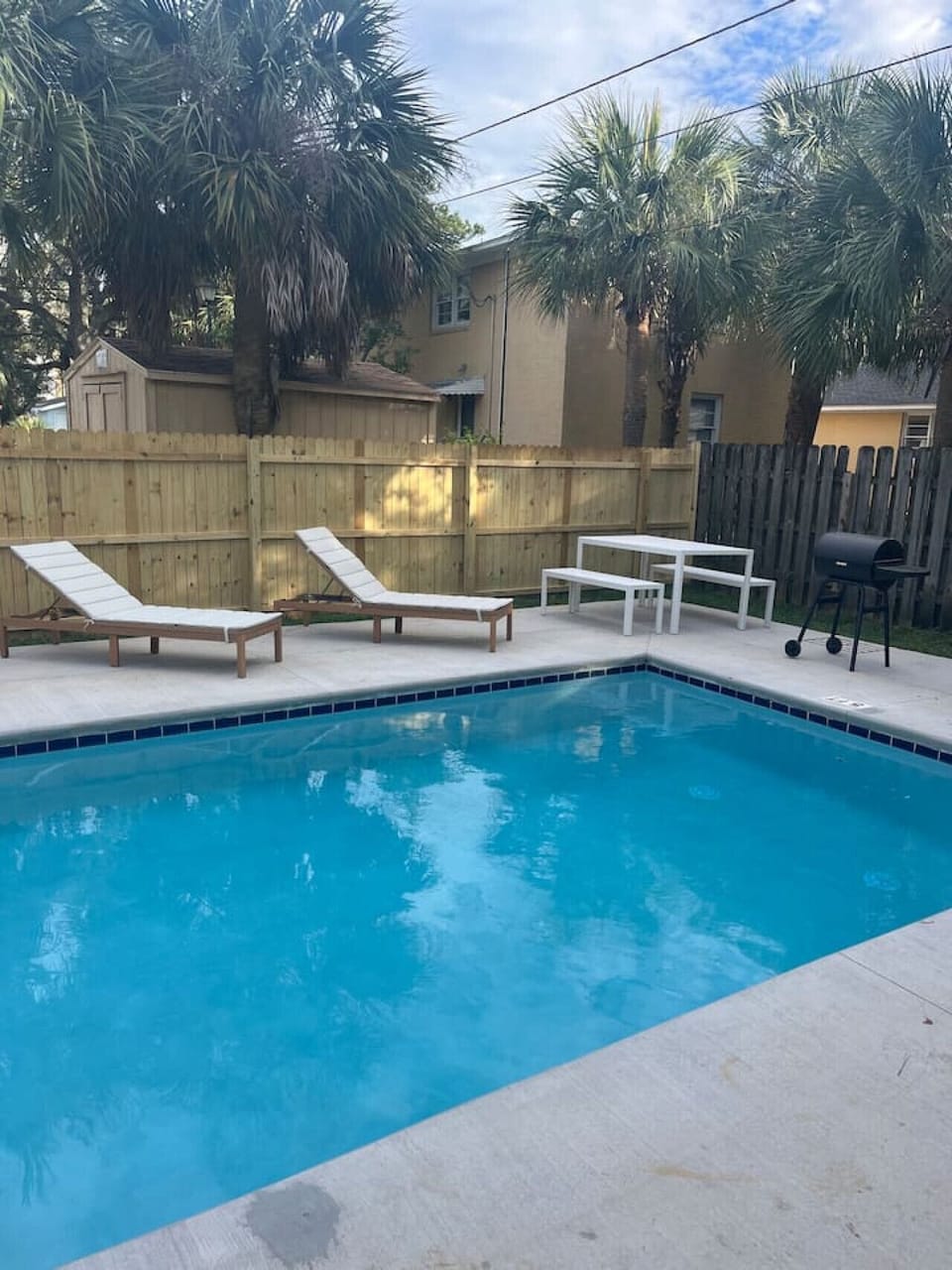 Enjoy access to a shared pool with loungers, BBQ grill, and outdoor seating. Great for laid-back outdoor time