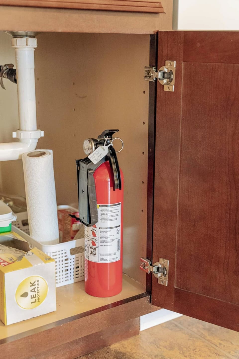 Fire extinguisher under the kitchen sink
