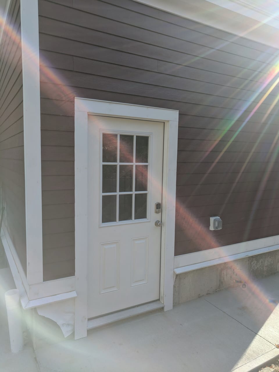 Private entrance to the unit located at the  back of the house