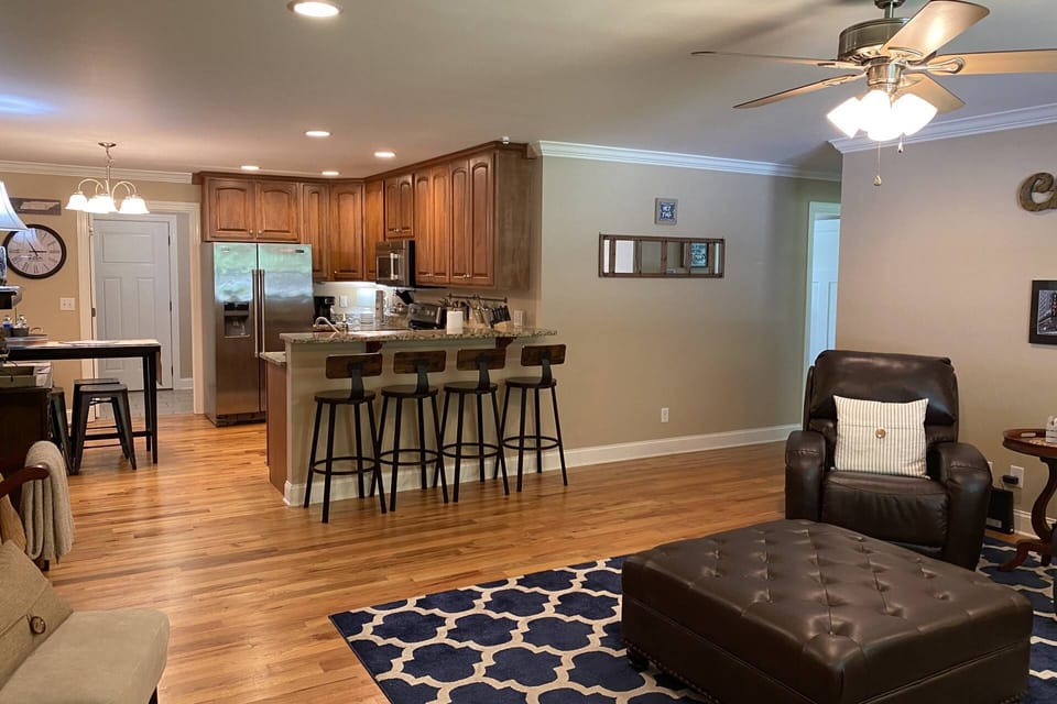 Fully stocked kitchen has ample dishes, glasses, silverware, bowls, pots and pans for quick food on the run or full meals.