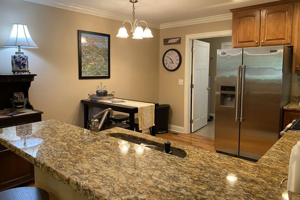 Dining table seats 4, with additional 4 stools at the kitchen island
